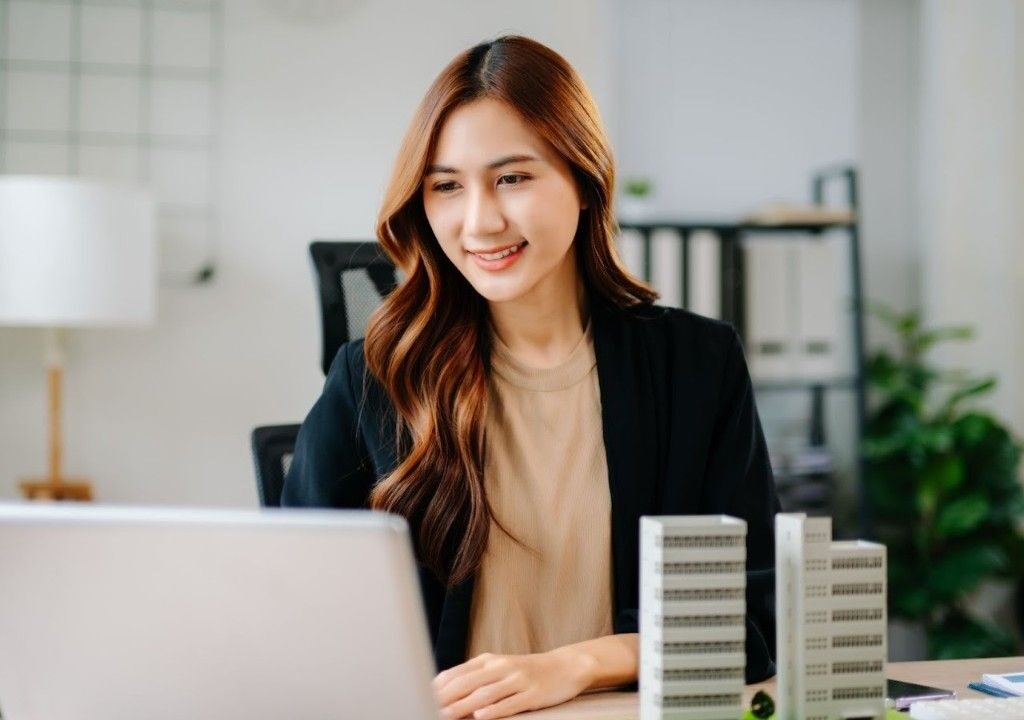 Professional using real estate transaction coordinator software to automate closings and scale business